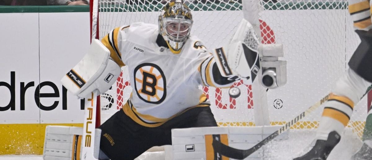 Boston Bruins goaltender Jeremy Swayman (1) makes a glove save on a Dallas Stars shot during the first period at the American Airlines Center.