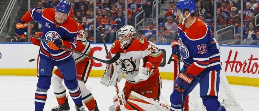 Edmonton Oilers forward Trent Frederic (10) deflects a shot on Anaheim Ducks goaltender Ville Husso (33) during the first period at Rogers Place.