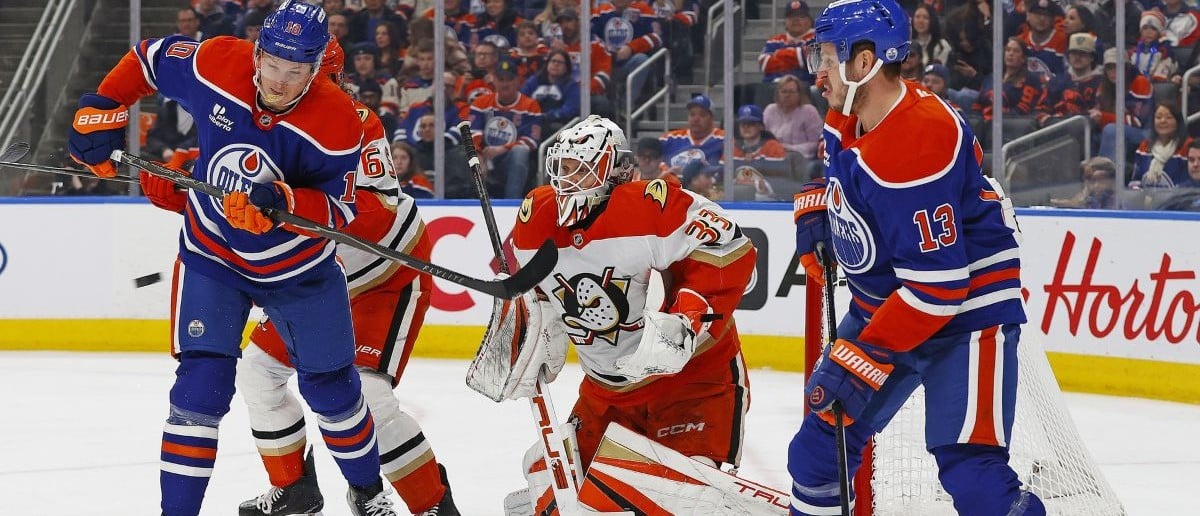 Edmonton Oilers forward Trent Frederic (10) deflects a shot on Anaheim Ducks goaltender Ville Husso (33) during the first period at Rogers Place.