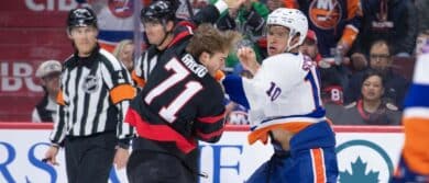 Ottawa Senators center Ridly Greig (71) fights with New York Islanders center Brayden Schenn (10) in the first period at the Canadian Tire Centre