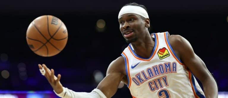 Oklahoma City Thunder guard Shai Gilgeous-Alexander (2) passes the ball against the Philadelphia 76ers during the third quarter at Xfinity Mobile Arena.