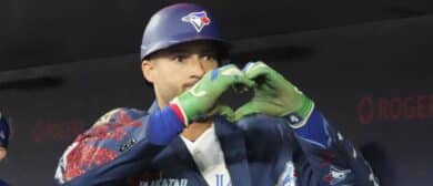 Toronto Blue Jays designated hitter George Springer (4) shows the heart symbol after his solo home run against the Athletics in the first inning at Rogers Centre