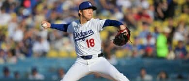 Los Angeles Dodgers pitcher Yoshinobu Yamamoto (18) pitches during the first inning against the Cleveland Guardians at Dodger Stadium