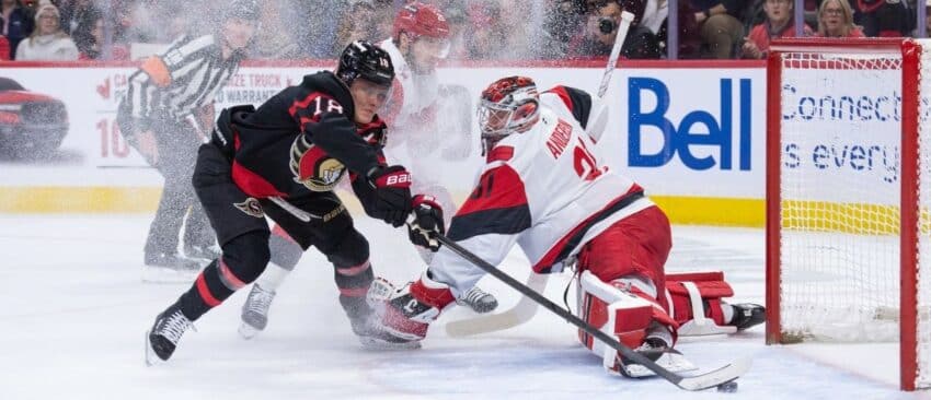 Ottawa Senators center Tim Stutzle (18) scores against Carolina Hurricanes fgoalie Frederik Andersen (31) in the first period at the Canadian Tire Centre