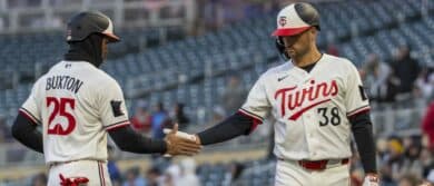 Minnesota Twins designated hitter Byron Buxton (25) shakes hands with right fielder Matt Wallner (38) after scoring a run against the Detroit Tigers in the third inning at Target Field