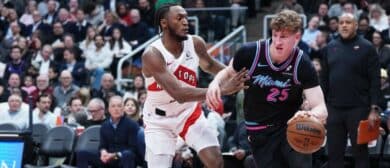 Miami Heat guard Kasparas Jakucionis (25) controls the ball as Toronto Raptors guard Immanuel Quickley (5) defends during the first quarter at Scotiabank Arena