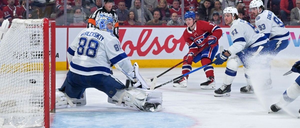 Montreal Canadiens forward Cole Caufield (13) scores his fiftieth goal of the season against Tampa Bay Lightning goalie Andrei Vasilevskiy (88) during the second period at the Bell Centre.