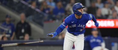 Toronto Blue Jays shortstop Andres Gimenez (0) hits a double against the Minnesota Twins during the sixth inning at Rogers Centre