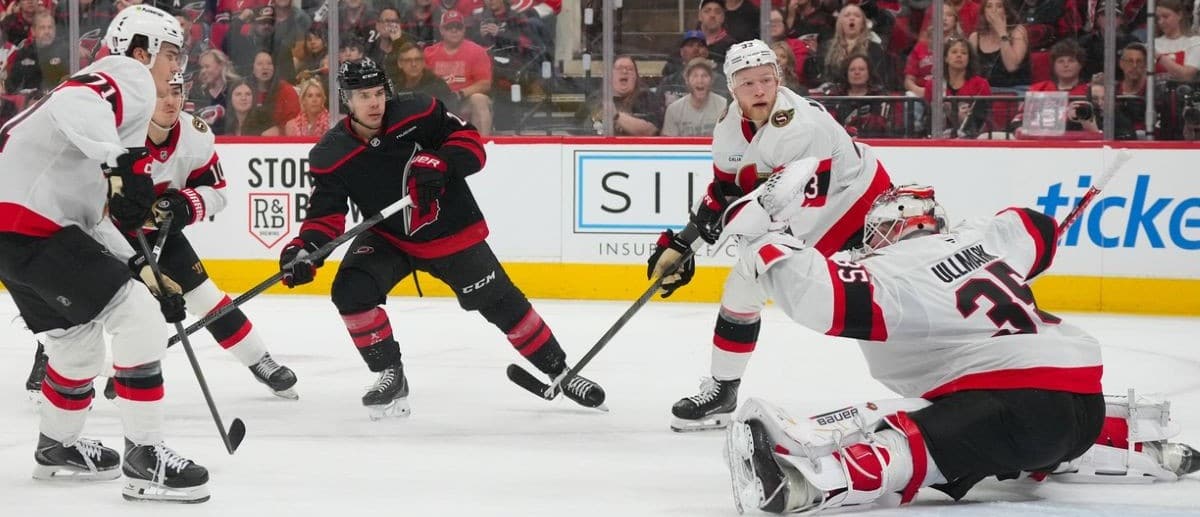Ottawa Senators goaltender Linus Ullmark (35) makes glove save on Carolina Hurricanes center Logan Stankoven (22) shot during the third period in game one of the first round of the 2026 Stanley Cup Playoffs at Lenovo Center