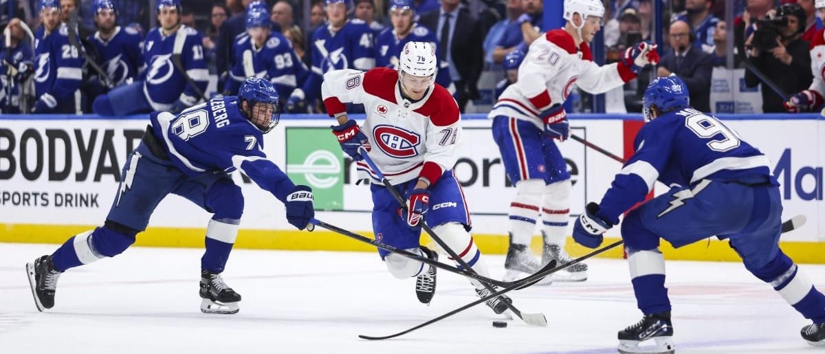 Montreal Canadiens forward Zachary Bolduc (76) skates between Tampa Bay Lightning defenseman Emil Lilleberg (78) and forward Joe Veleno (90) during the second period in game one of the first round of the 2026 Stanley Cup Playoffs at Benchmark International Arena