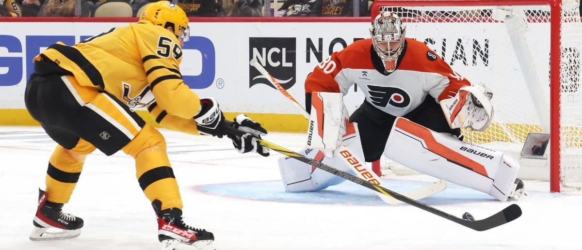 Philadelphia Flyers goaltender Dan Vladar (80) defends the net against Pittsburgh Penguins right wing Egor Chinakhov (59) during the third period in game two of the first round of the 2026 Stanley Cup Playoffs at PPG Paints Arena