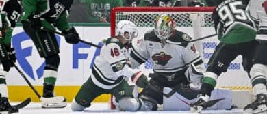 Dallas Stars left wing Jason Robertson (21) scores a goal past Minnesota Wild defenseman Jared Spurgeon (46) and goaltender Jesper Wallstedt (30) during the third period in game five of the first round of the 2026 Stanley Cup Playoffs at American Airlines Center.