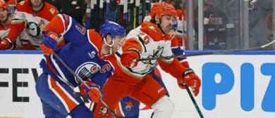 Edmonton Oilers forward Connor McDavid (97) and Anaheim Ducks forward Chris Kreider (20) chases a loose puck during the second period in game five of the first round of the 2026 Stanley Cup Playoffs at Rogers Place