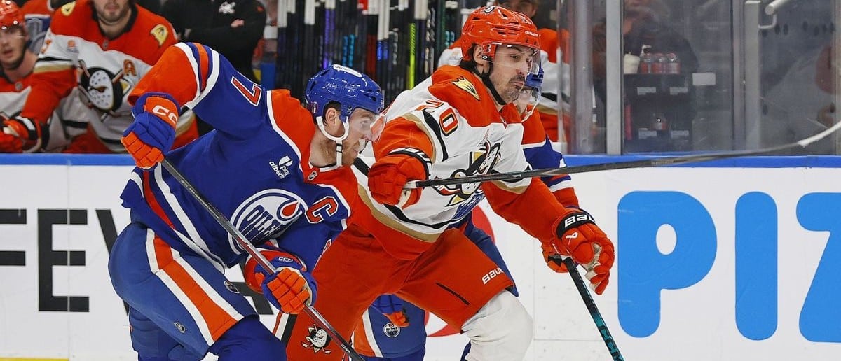 Edmonton Oilers forward Connor McDavid (97) and Anaheim Ducks forward Chris Kreider (20) chases a loose puck during the second period in game five of the first round of the 2026 Stanley Cup Playoffs at Rogers Place