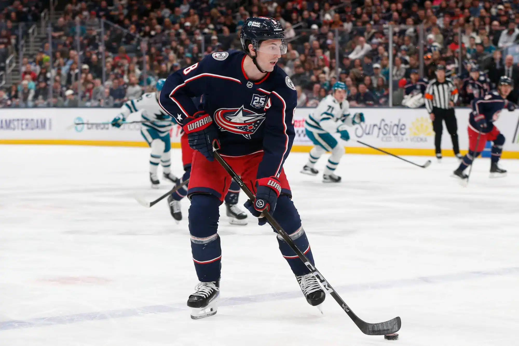 Mar 28, 2026; Columbus, Ohio, USA; Columbus Blue Jackets defenseman Zach Werenski (8) controls the puck against the San Jose Sharks during the first period at Nationwide Arena.