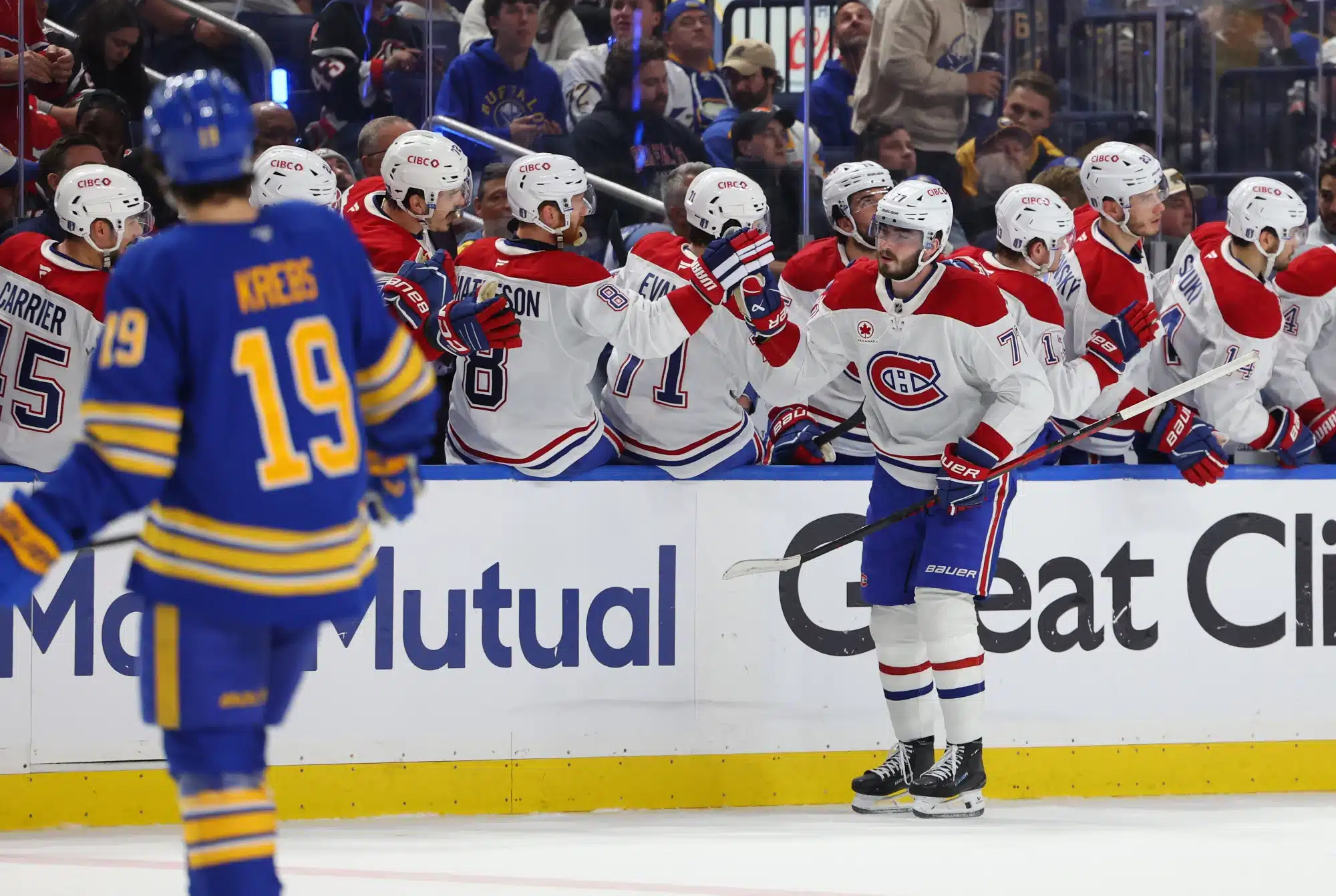 May 6, 2026; Buffalo, New York, USA; Montréal Canadiens center Kirby Dach (77) celebrates his goal with teammates during the second period against the Buffalo Sabres in game one of the second round of the 2026 Stanley Cup Playoffs at KeyBank Center. 