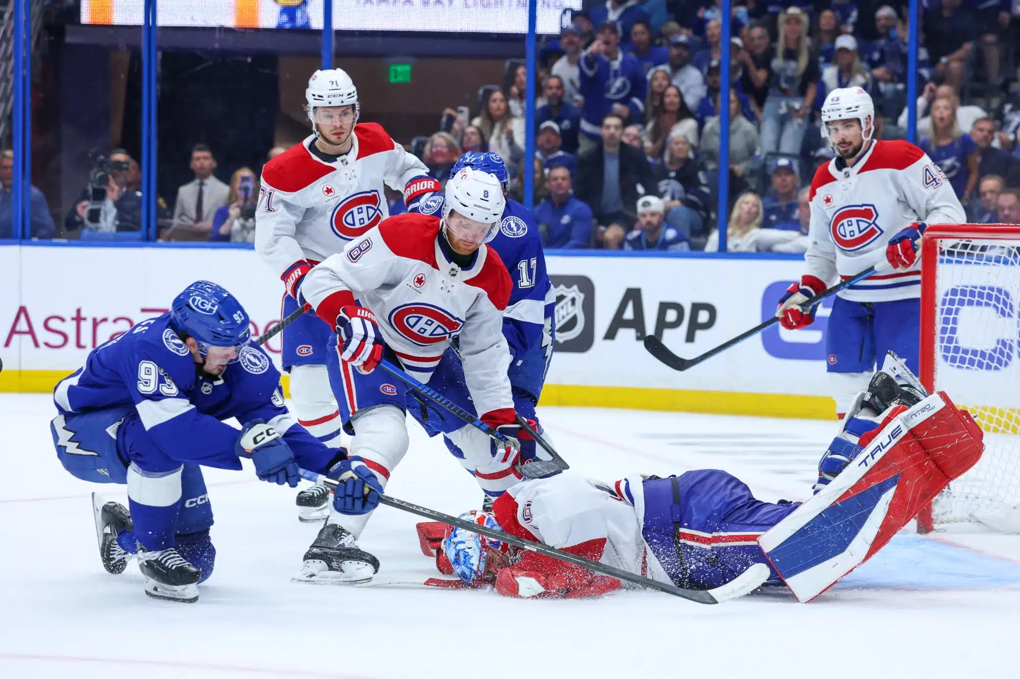 Apr 29, 2026; Tampa, Florida, USA; Montreal Canadiens goaltender Jakub Dobes (75) dives on the puck in front of Tampa Bay Lightning center Gage Goncalves (93) in the third period during game five of the first round of the 2026 Stanley Cup Playoffs at Benchmark International Arena. 