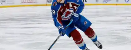 May 13, 2026; Denver, Colorado, USA; Colorado Avalanche center Nathan MacKinnon (29) controls the puck in overtime against the Minnesota Wild in game five of the second round of the 2026 Stanley Cup Playoffs at Ball Arena.