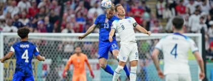 United States of America defender Tim Ream (13) battles for a header against England forward Harry Kane (9) during the first half of a group stage match during the 2022 World Cup at Al Bayt Stadium.