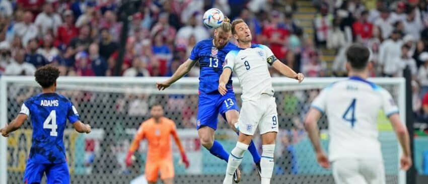 United States of America defender Tim Ream (13) battles for a header against England forward Harry Kane (9) during the first half of a group stage match during the 2022 World Cup at Al Bayt Stadium.