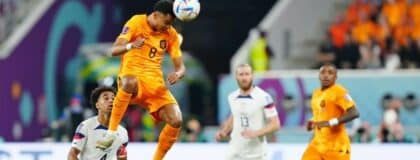 Netherlands forward Cody Gakpo (8) heads the ball against the United States of America during the second half of a round of sixteen match in the 2022 FIFA World Cup at Khalifa International Stadium
