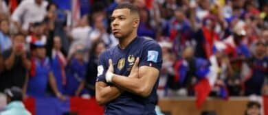 France forward Kylian Mbappe (10) celebrates after scoring a goal against Argentina on a penalty kick for his third goal of the match during extra time of the 2022 World Cup final at Lusail Stadium.