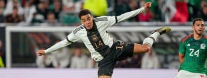 Germany midfielder Jamal Musiala (14) shoots the ball against Mexico during the second half at Lincoln Financial Field