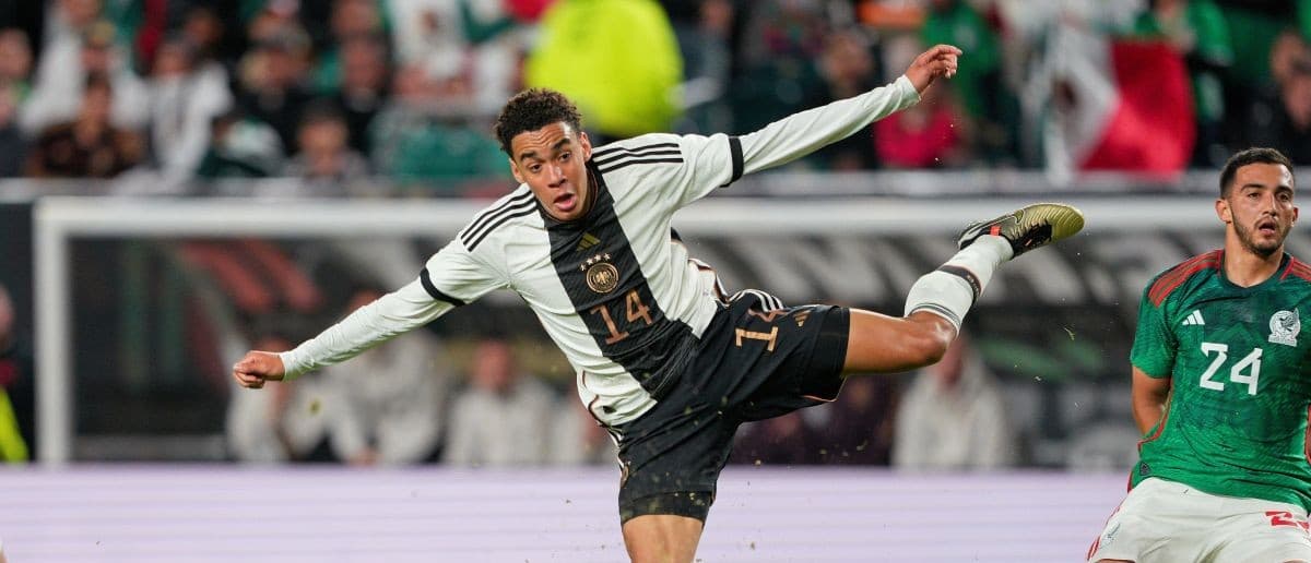 Germany midfielder Jamal Musiala (14) shoots the ball against Mexico during the second half at Lincoln Financial Field