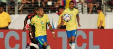 Brazil midfielder Raphinha (11) pursues the ball against Colombia midfielder Jhon Arias (obscured) during the second half at Levi's Stadium