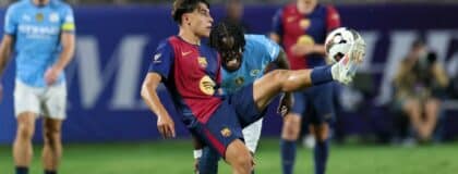 Barcelona forward Lamine Yamal (27) controls the ball against Manchester City in the second half during a Champions Tour friendly match at Camping World Stadium
