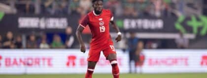 Canada defender Alphonso Davies (19) dribbles the ball against Mexico during the first half at AT&T Stadium