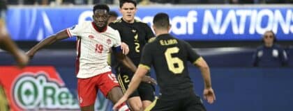 Canada defender Alphonso Davies (19) kicks the ball past Mexico defender Israel Reyes (2) in the first half during a Concacaf Nations League semifinal match at SoFi Stadium.