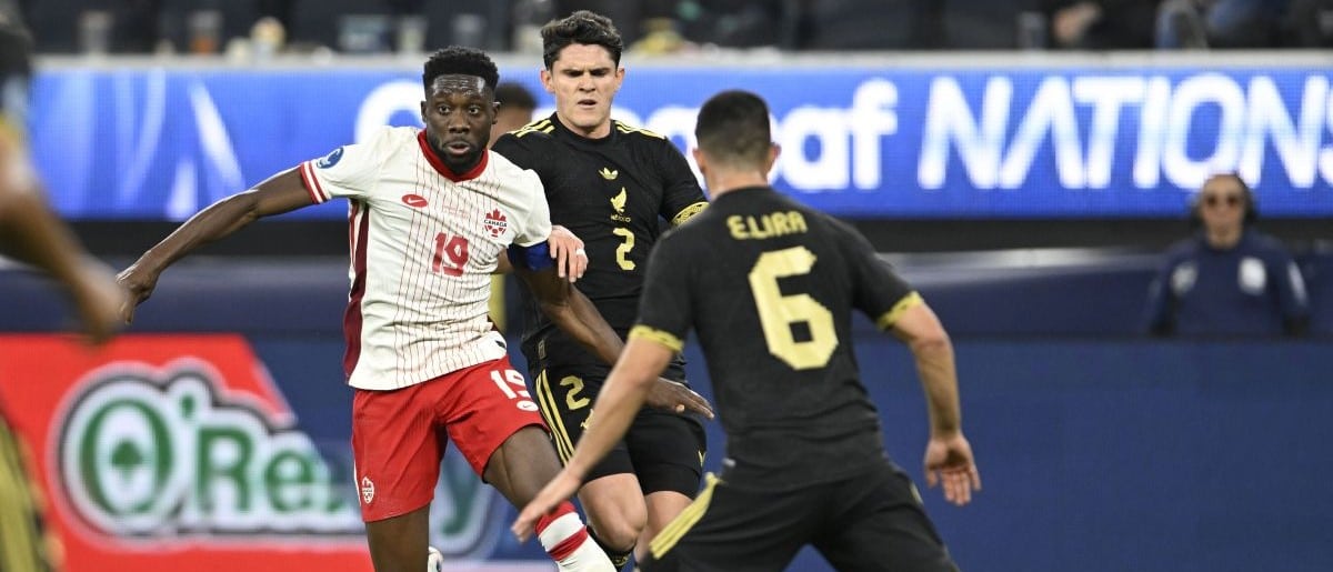 Canada defender Alphonso Davies (19) kicks the ball past Mexico defender Israel Reyes (2) in the first half during a Concacaf Nations League semifinal match at SoFi Stadium.