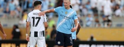 Manchester City forward Erling Haaland (9) with Juventus FC midfielder Vasilijie Adzic (17) after a group stage match of the 2025 FIFA Club World Cup at Camping World Stadium.