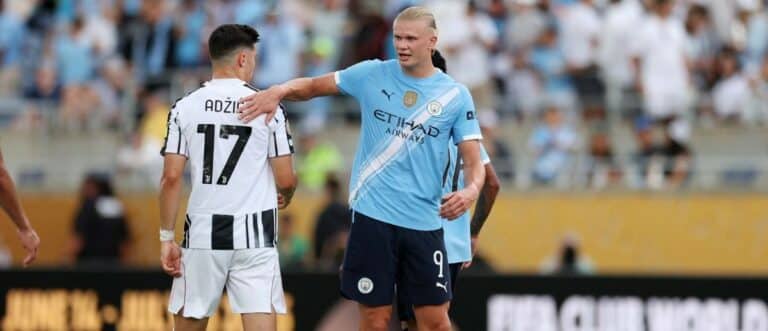 Manchester City forward Erling Haaland (9) with Juventus FC midfielder Vasilijie Adzic (17) after a group stage match of the 2025 FIFA Club World Cup at Camping World Stadium.