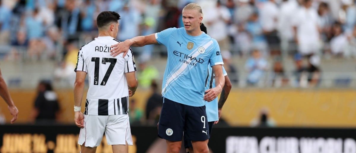Manchester City forward Erling Haaland (9) with Juventus FC midfielder Vasilijie Adzic (17) after a group stage match of the 2025 FIFA Club World Cup at Camping World Stadium.