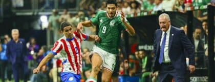 Paraguay forward Antonio Sanabria (9) and Mexico forward Raul Jimenez (9) fight for the ball in the second half in a match between Mexico and Paraguay at the Alamodome