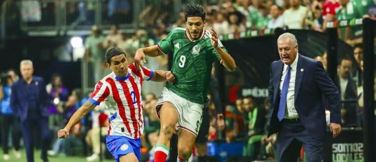Paraguay forward Antonio Sanabria (9) and Mexico forward Raul Jimenez (9) fight for the ball in the second half in a match between Mexico and Paraguay at the Alamodome