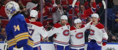 Montréal Canadiens right wing Cole Caufield (13) celebrates his second goal of the game with teammates during the third period against the Buffalo Sabres at KeyBank Center