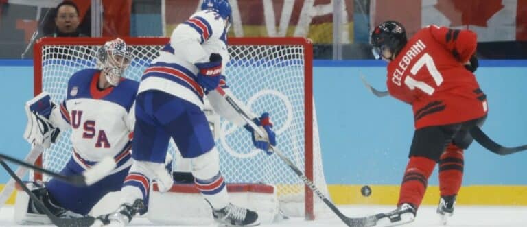Macklin Celebrini (17) of Canada shoots against Connor Hellebuyck (37) of the United States in the men's ice hockey gold medal game during the Milano Cortina 2026 Olympic Winter Games at Milano Santagiulia Ice Hockey Arena