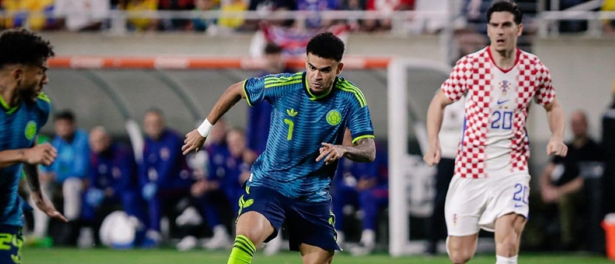 Colombia forward Luis Diaz (7) controls the ball while being trailed by Croatia forward Igor Matanovic (20) during the first half at Camping World Stadium.