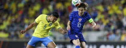 Croatia midfielder Luka Modric (10) heads the ball [past Brazil midfielder Casemiro (5) in the first half during an international friendly at Camping World Stadium