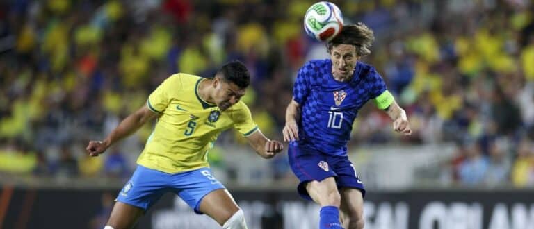 Croatia midfielder Luka Modric (10) heads the ball [past Brazil midfielder Casemiro (5) in the first half during an international friendly at Camping World Stadium