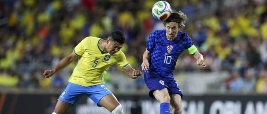 Croatia midfielder Luka Modric (10) heads the ball [past Brazil midfielder Casemiro (5) in the first half during an international friendly at Camping World Stadium