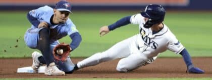 Tampa Bay Rays right fielder Jonny DeLuca (21) steals second base from Toronto Blue Jays shortstop Andres Gimenez (0) in the seventh inning at Tropicana Field