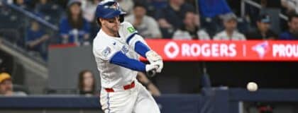 Toronto Blue Jays second base Ernie Clement (22) hits a single in the fourth inning against the Los Angeles Angels at Rogers Centre
