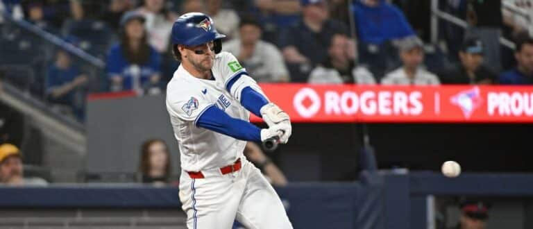 Toronto Blue Jays second base Ernie Clement (22) hits a single in the fourth inning against the Los Angeles Angels at Rogers Centre