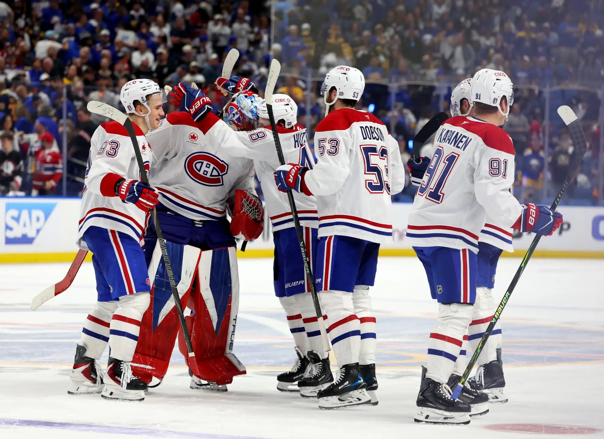 May 18, 2026; Buffalo, New York, USA; The Montréal Canadiens celebrate an overtime win over the Buffalo Sabres in game seven of the second round of the 2026 Stanley Cup Playoffs at KeyBank Center.