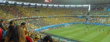 Soccer fans watching a World Cup match between Brazil and Mexico inside a stadium in Fortaleza, Brazil