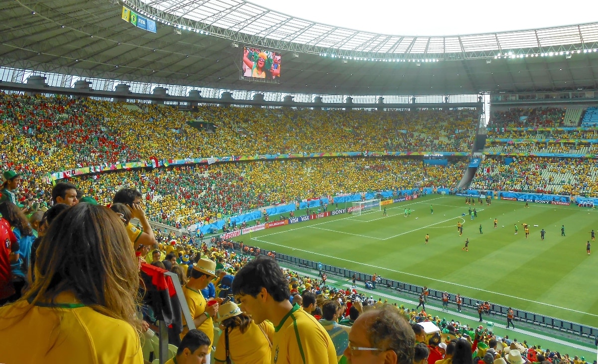 Soccer fans watching a World Cup match between Brazil and Mexico inside a stadium in Fortaleza, Brazil
